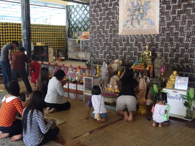 People Praying At The Million Bottle Temple, Thailand