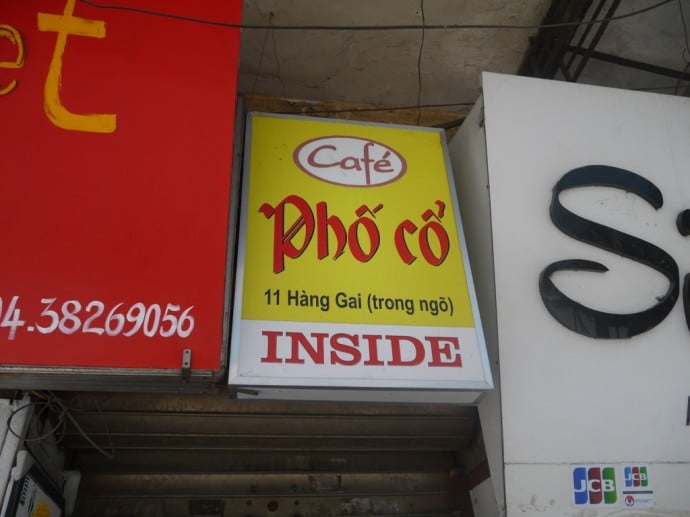 Cafe Pho Co Sign Above Souvenir Shop