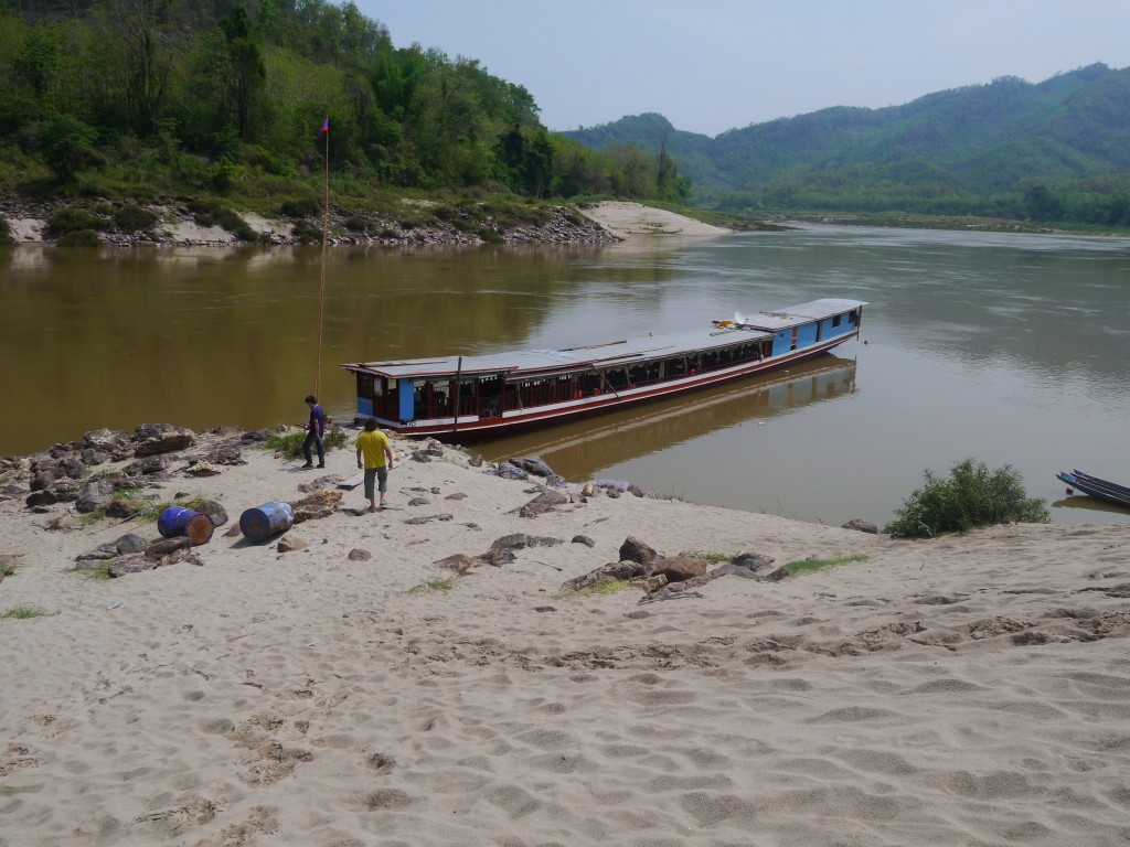 Our Boat Waiting At A Sandy Beach On The Mekong River