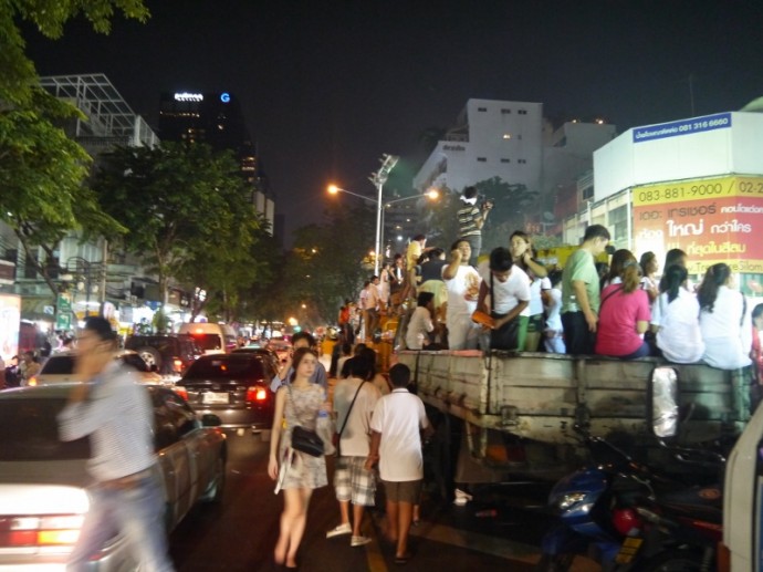 People Standing On Lorries To Get View of Hindu Festival