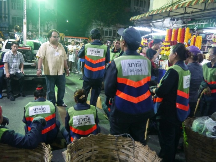 Workmen Waiting To Clean Up After The Festival