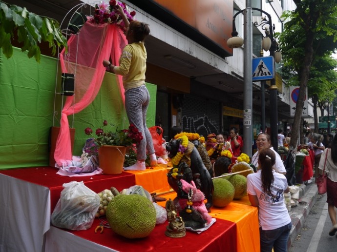 Woman Working On One Of Hundreds Of Shrines