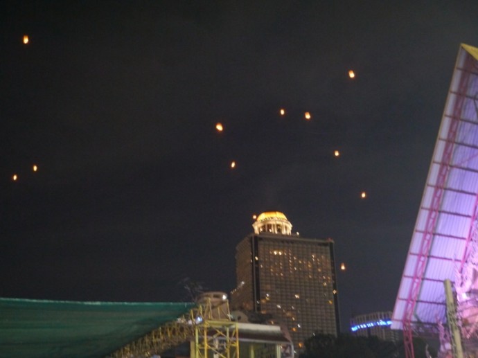 Lanterns Floating Against A Backdrop Of State Tower Lanterns Floating Against A Backdrop Of State Tower