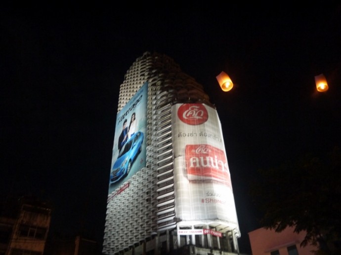 Lanterns Floating In Front Of Bangkok's Famous Ghost Tower