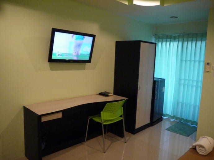 Large Desk, Chair. TV, Wardrobe and Fridge At Better Place Hotel