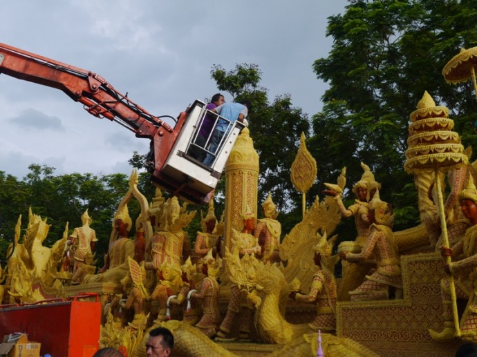 Adjusting A Candle At Ubon Ratchathani Candle Festival 2014