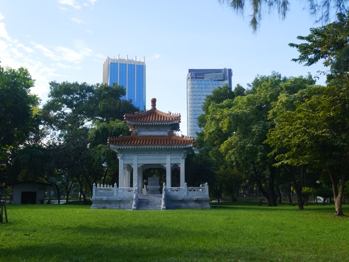 An Old Building In Lumphini Park Contrasts With Modern Skyscrapers