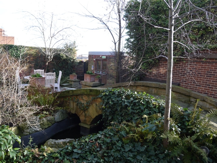 A Bridge Over The Stream At Kensington Roof Gardens, London